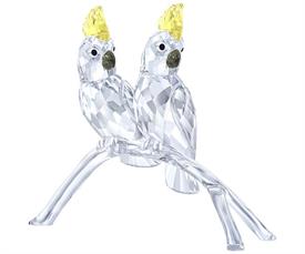 _,COCKATOOS. PAIR OF CLEAR & YELLOW COCKATOOS PERCHED ON A CLEAR BRANCH. 3.5" TALL, 4.25" LONG, 1.75" WIDE                                  