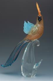 _,54-5131 AMBER PARROT OPEN WINGS IN INDIGO BLUE AND GOLD ON CLEAR CURVED BASE 16.25"T X 5.5"W X 4.25"D.                                    