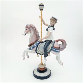 ,1470 'BOY ON CAROUSEL HORSE' FIGURINE. 15.4" TALL, 9" LONG, 4.6" WIDE                                                                      
