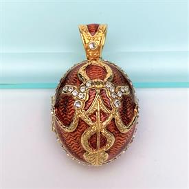 ,'FABRI' EGG LOCKET WITH GOLDEN ROSE INSIDE. FABERGE INSPIRED WITH SHADES OF RED ENAMEL & CLEAR CRYSTALS. 1.65" LONG, 1" WIDE               