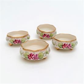 ,SET OF 4 HAND PAINTED FOOTED SALT CELLARS FOR MARSHALL FIELD & CO., CHICAGO. CA. 1906-1930. ONE HAS SMALL CHIP. .75" TALL, 1.75" WIDE      