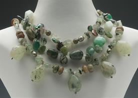SAJEN MULTISTRAND GREEN STONE & PEARL NECKLACE. INCLUDES PERIDOT, MOSS AGATE, SERPENTINE, JADE, & GREEN PEARLS.                             