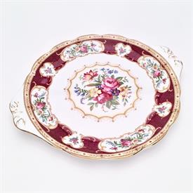 ROUND HANDLED CAKE PLATE. 10.4" X 9.2" WIDE                                                                                                 