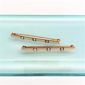 ,EDWARDIAN ERA PAIR OF 14K YELLOW GOLD, SEED PEARL & WHITE ENAMEL BAR BROOCHES. SIGNED BY UNKNOWN MAKER. 1.75" LONG (EACH)                  