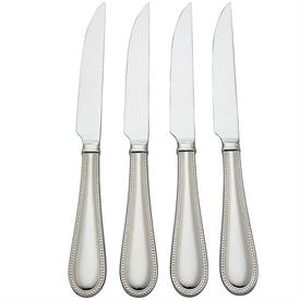 -4-PIECE STEAK KNIFE SET. 9.75" LONG. DISHWASHER SAFE STAINLESS STEEL. BREAKAGE REPLACEMENT AVAILABLE.                                      