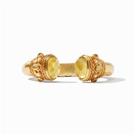 -,HINGE CUFF IN IRIDESCENT CITRINE YELLOW. ROSE CUT GLASS GEM END CAPS WITH MOTHER OF PEARL ACCENTS IN 24K GOLD PLATED CUFF. 2.5" DIAMETER  