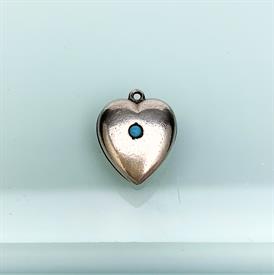 ,ANTIQUE PUFFY HEART CHARM WITH TURQUOISE CENTER. STERLING SILVER. .6" LONG, .5" WIDE                                                       