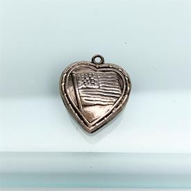 ,VINTAGE PUFFY HEART CHARM WITH U.S. FLAG ON BOTH SIDES. STERLING SILVER. .75" LONG, .65" WIDE                                              