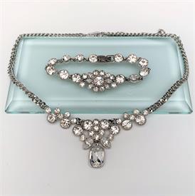 ,GIVENCHY SILVER TONE NECKLACE & BRACELET SET WITH CLEAR SWAROVSKI CRYSTALS. BRACELET MEASURES 7" LONG, NECKLACE ADJUSTS BETWEEN 16" & 19"  